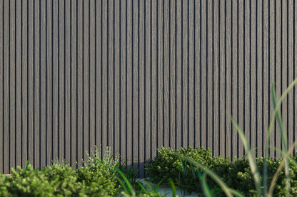 Stone Gray Exterior Slat Wall Paneling With Black Accents and Embossed Wood-Effect Composite Siding